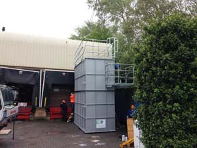 The pre-assembled top section is mounted on the centre section.