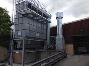 Once the filter system has been positioned, the fan and chimney can be installed.
